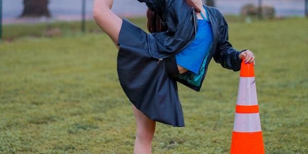Side view of a person performing a stretching exercise.